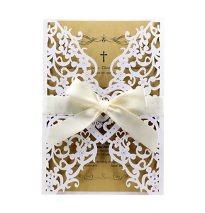 Detailed laser cut heart wedding invitation with gold pearl paper and silk ribbon