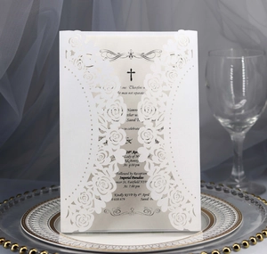 Laser cut white rose wedding invitation with pearl shimmer finish and elegant cross design