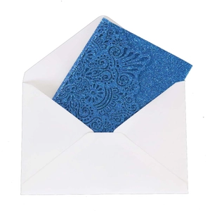 Navy blue glitter laser cut wedding invitation with intricate floral design and white envelope