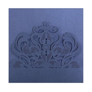 Detailed laser-cut lace pattern on navy blue pearlescent paper wedding invitation card