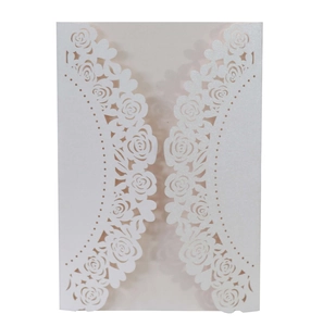Laser-cut white pearlescent paper wedding invitation with elegant rose flower patterns