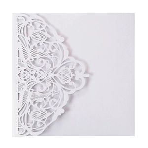 Detailed laser-cut lace pattern on white pearlescent paper wedding invitation cover