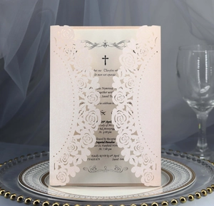 Detail of laser-cut rose invitation card in pearlescent pink for weddings and events