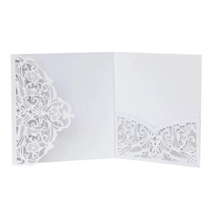 Detail of laser-cut white lace invitation pocket with intricate floral hollow patterns
