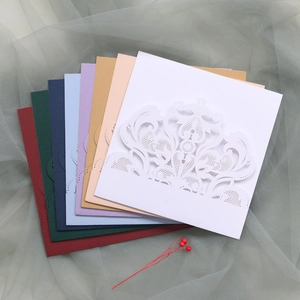 Detailed laser-cut wedding invitation pockets in multiple elegant pearlescent colors