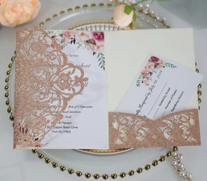 Detailed laser-cut rose gold glitter wedding invitation set with floral printed cards