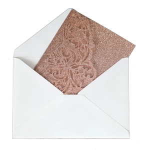 Glitter rose gold laser cut invitation card with elegant floral pattern and white envelope