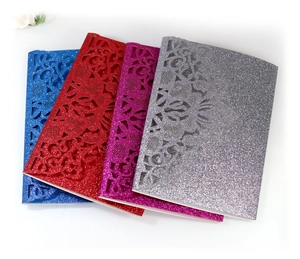 Detailed laser cut mandala floral patterns on glitter wedding invitation card sets