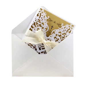Laser cut white floral wedding invitation with gold card, envelope and ivory silk ribbon