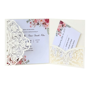Elegant laser-cut lace wedding invitation set with floral inner card and RSVP card