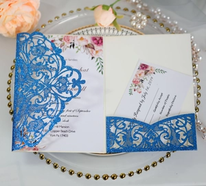 Detail of laser-cut navy glitter wedding invitation set with vintage floral inner card