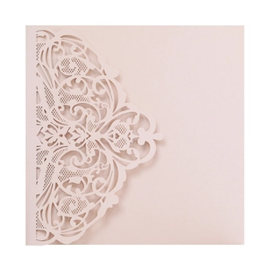 Detailed laser-cut floral pattern on elegant pearlescent paper invitation cover