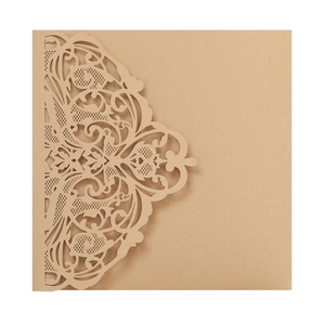 Intricate laser-cut floral patterns on brown pearlescent paper wedding invitation cover
