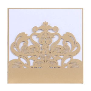 Elegant gold laser-cut lace wedding invitation cover with a blank white inner card sheet