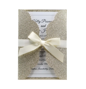 Champagne gold glitter laser cut wedding invitation with white insert and satin ribbon bow