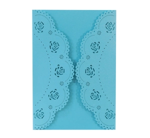Detail of sky blue laser-cut rose card with pearlescent texture and lace patterns