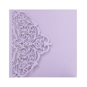 Detail of laser-cut floral lavender pearl paper wedding invitation with shimmer finish