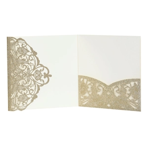 Macro view of gold glitter laser-cut lace invitation card with elegant hollow floral pattern