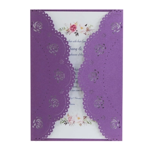 Detail of laser-cut rose hollow invitation with elegant purple cover and floral inner page