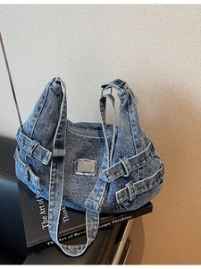 Blue washed denim canvas messenger bag with metal buckles and stylish utility straps