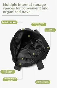 Detailed view showing the interior compartments and multiple pockets of the black tote bag