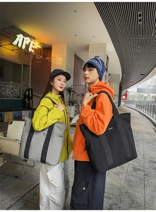 Outdoor shot of minimalist grey and black large capacity tote bags for daily commute