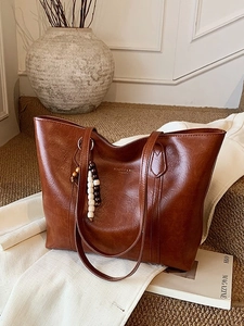 Vintage caramel brown large capacity tote bag with leather texture and wood bead charm