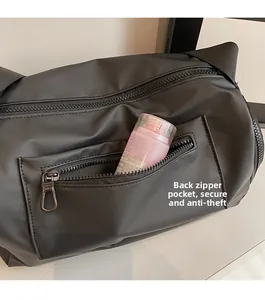 Detailed view of back hidden zipper pocket for anti-theft security on black bag