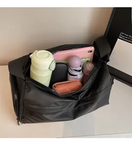 Internal view of a black shoulder bag showing high capacity for tablets and umbrellas