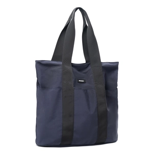 Detail of dark blue waterproof nylon tote bag with dual straps and MOCOBAG logo