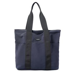 Detail showing side pockets and branding on a large navy nylon tote bag for women