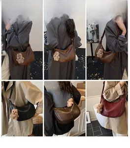 Detailed views of crescent leather tote bags in four colors with cute bear charms
