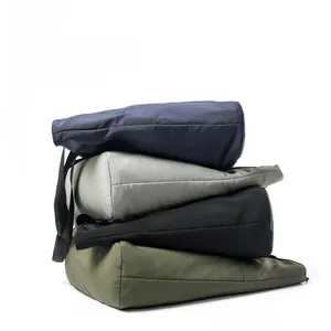 Stack of nylon tote bags in blue, gray, black, and olive green showing soft material texture