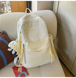 Detail of cute star pattern backpack with RKDBAG embroidery and plush cloud keychain