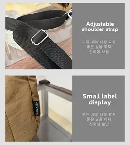 Détail de la bandoulière réglable noire et étiquette sur le sac seau marron