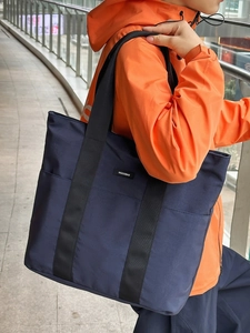 Deep blue high capacity nylon tote bag for commuting with spacious front pocket