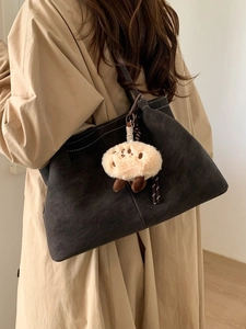 Retro charcoal grey matte tote bag with contrast stitching and capybara plush charm