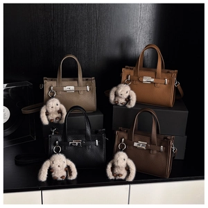 Litchi pattern tote bags in four colors with cute rabbit charms and silver hardware