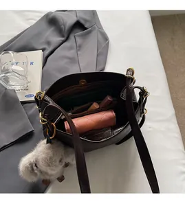 Detailed interior of dark brown leather tote bag with ample space for wallet and phone