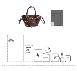 Detailed capacity view of brown leather bucket bag showing everyday items and space
