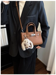 Brown litchi grain leather mini handbag with silver lock and fluffy rabbit charm