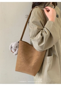 Caramel retro bucket bag with long shoulder strap and cute plush rabbit charm
