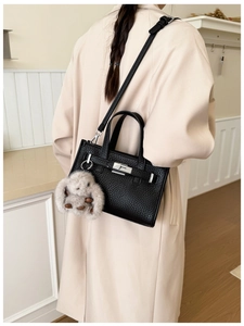 Black lychee leather mini tote bag with silver turn-lock and cute rabbit plush charm