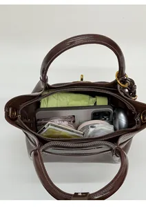 Top view of deep brown leather bucket bag showing large internal storage capacity