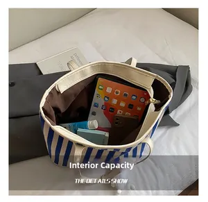 Macro view of the blue and white striped tote bag interior with large storage capacity