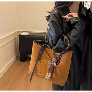Brown faux suede tote bag with embroidery details and a cute rabbit plush pendant accessory
