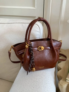 Vintage brown leather bucket bag for women with gold metal twist lock and handles