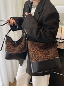 Large leopard print bucket bag and small matching tote set with sleek black leather trim