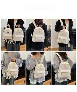 Detailed views of a white tweed backpack for women with gold heart charms and hardware