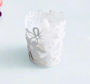 Detail of laser cut purple flower paper lampshade with a white LED flameless tea light